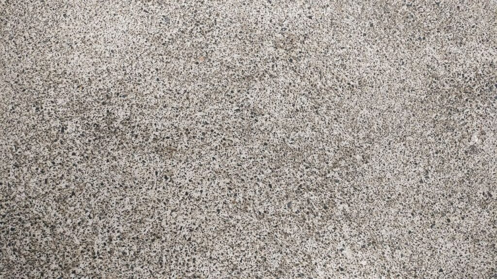 High-resolution image of a textured concrete surface, perfect for design backgrounds.