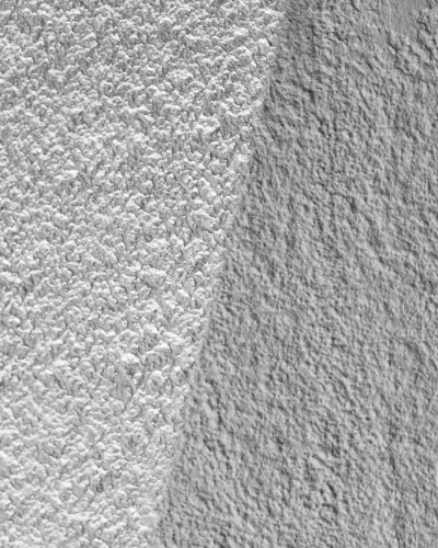 Abstract monochrome view of beach sand and ocean textures at Costa Azul, Argentina.